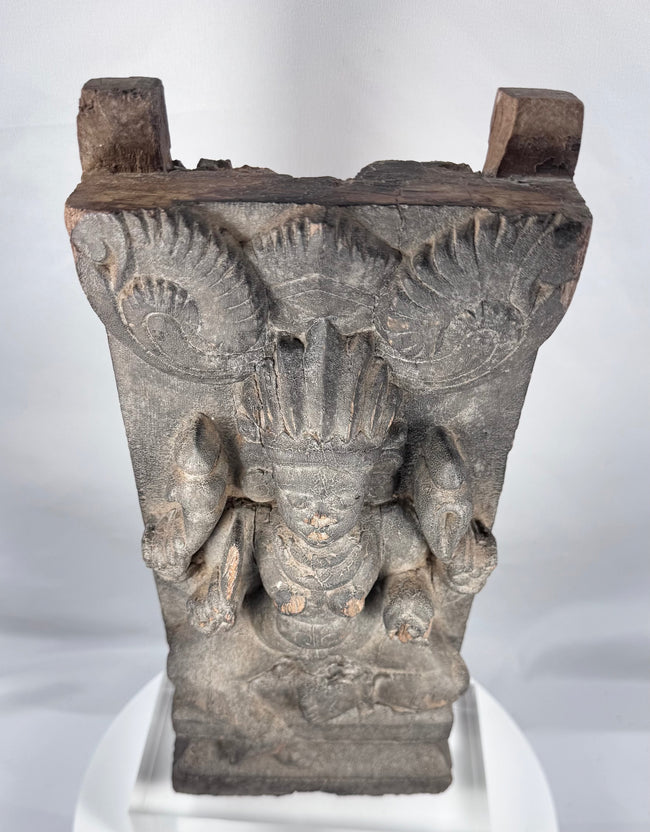 Carved wooden Gajalakshmi figure symbolizing prosperity and abundance