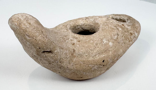 Ancient terracotta lighting vessel with intact reservoir and wick aperture