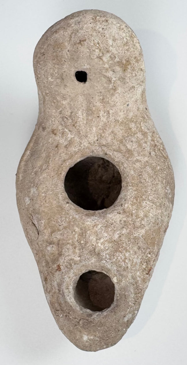 Near Eastern terracotta oil lamp with rounded enclosed reservoir