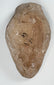 Early hand-formed ceramic oil lamp from the ancient Near East