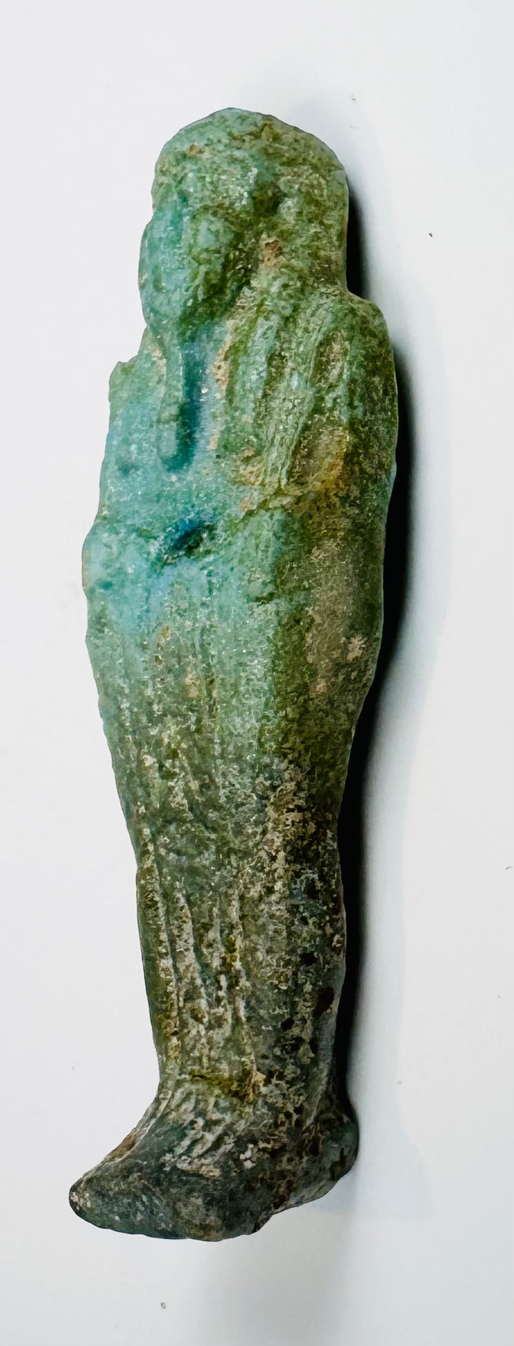 Small ancient faience ushabti with tapered body and projecting foot