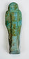 Egyptian funerary servant figure with hieroglyphs and natural burial encrustation