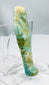 Small faience ushabti with mineral staining and natural burial deposits