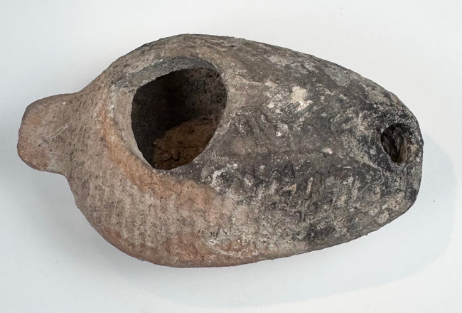 Late Antique Holy Land oil lamp with weathered terracotta surface