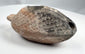 Ancient Levantine oil lamp with reddish-brown clay and burial patina