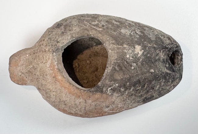 Byzantine terracotta oil lamp with incised geometric patterns