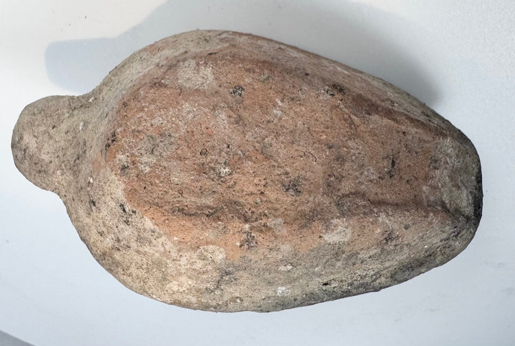 Early Byzantine pottery lamp with dark mineral deposits and encrustation