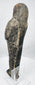 Detailed view of the upper body and vertically striated wig of an ancient Egyptian shabti