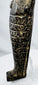 Close-up of ancient Egyptian hieroglyphs carved across the front of a circa 700–600 BCE shabti