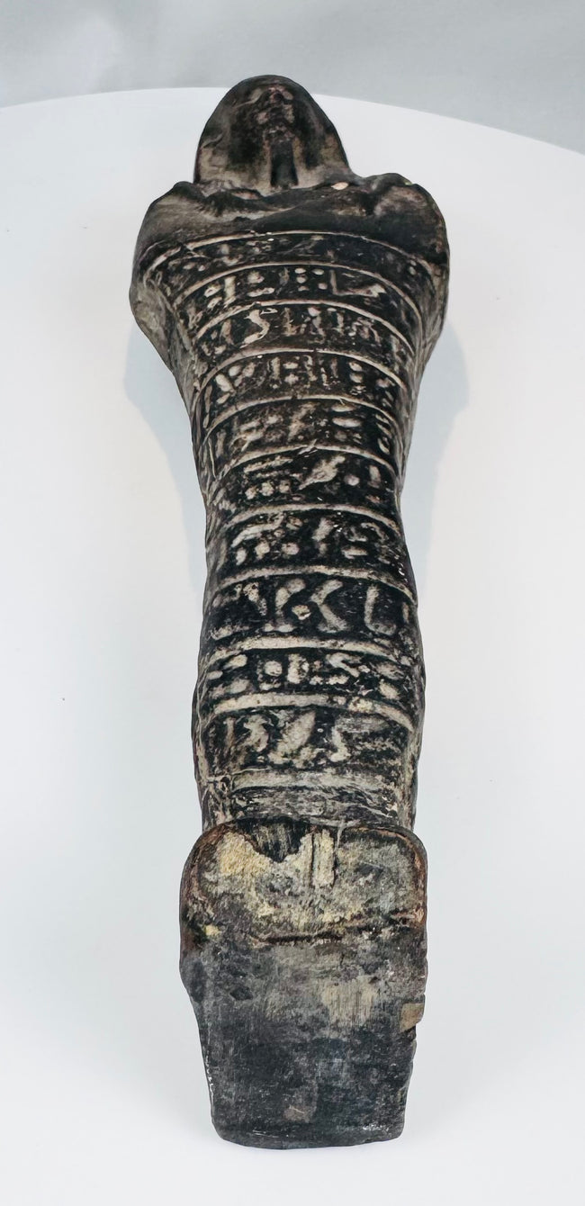 Full-length ancient Egyptian mummiform ushabti with striated wig, dorsal pillar, and inscribed body