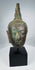 Sukhothai Period Buddha head with downcast eyes and elongated earlobes
