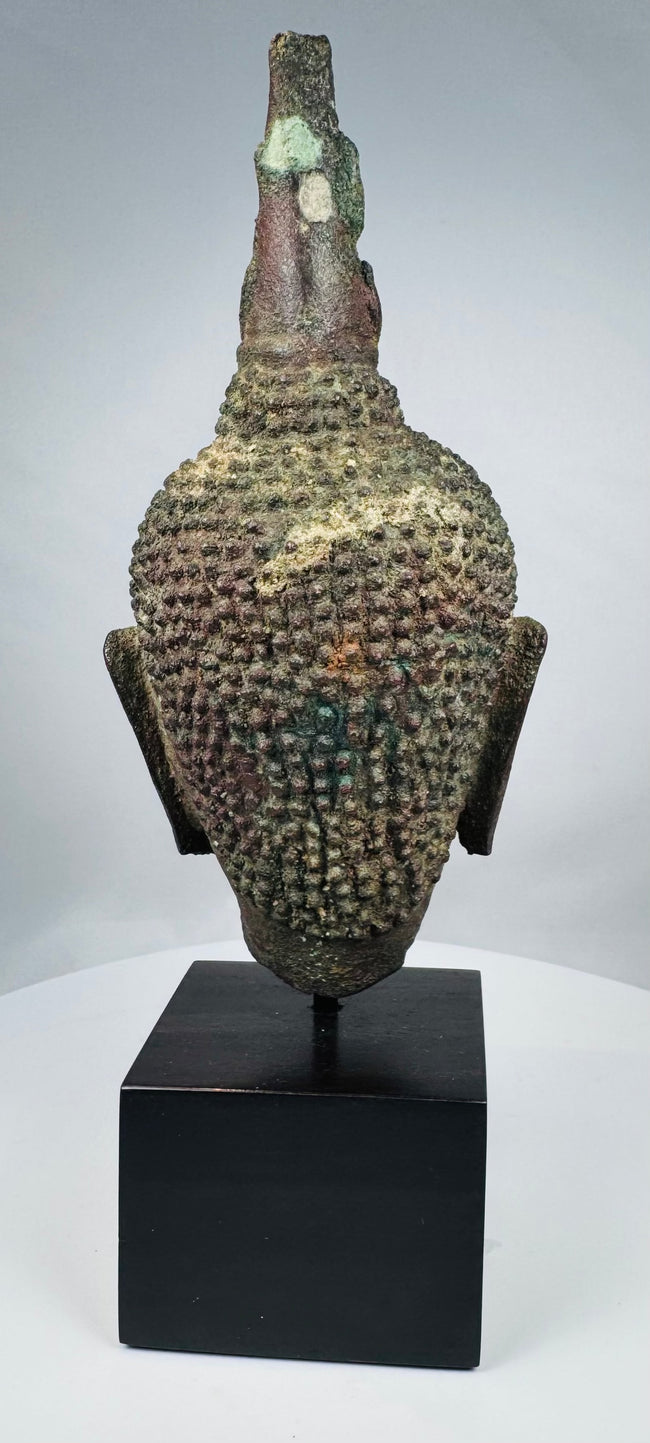 Ancient Thai Buddhist bronze sculpture with brown, red and green patination