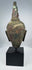Ancient Thai Buddhist bronze sculpture with brown, red and green patination