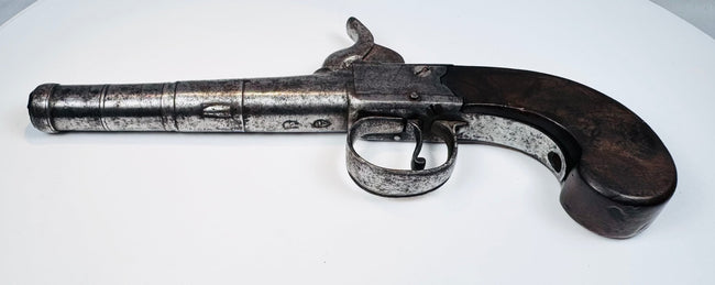 Antique London-marked percussion pistol with curved wooden grip