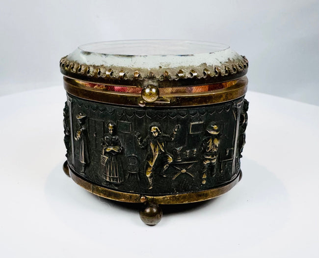 Antique French casket with detailed figures, furniture, and architectural scenes