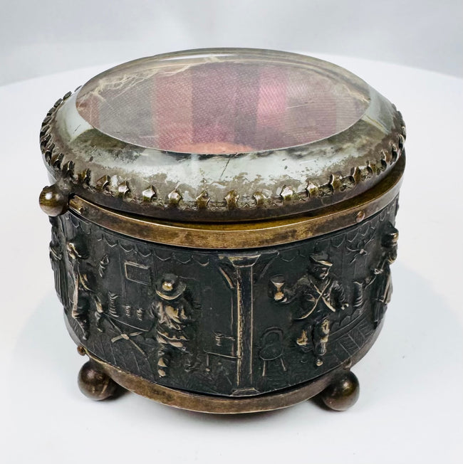 Raised tavern and domestic figures decorating a French jewelry casket