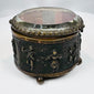 Open antique French casket displaying its surviving period textile lining