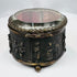 Small spherical clasp and ornate metalwork on a French jewelry casket