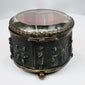 Small spherical clasp and ornate metalwork on a French jewelry casket