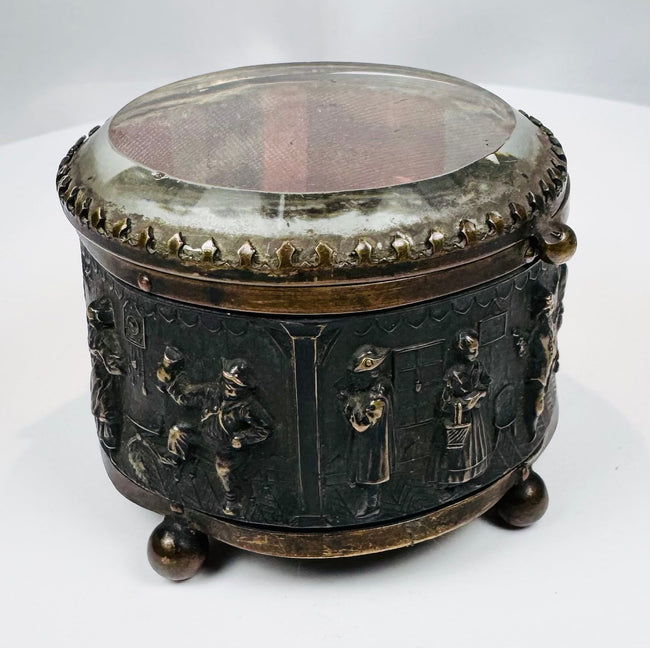 Four spherical feet supporting an antique French decorative casket