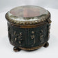 Four spherical feet supporting an antique French decorative casket