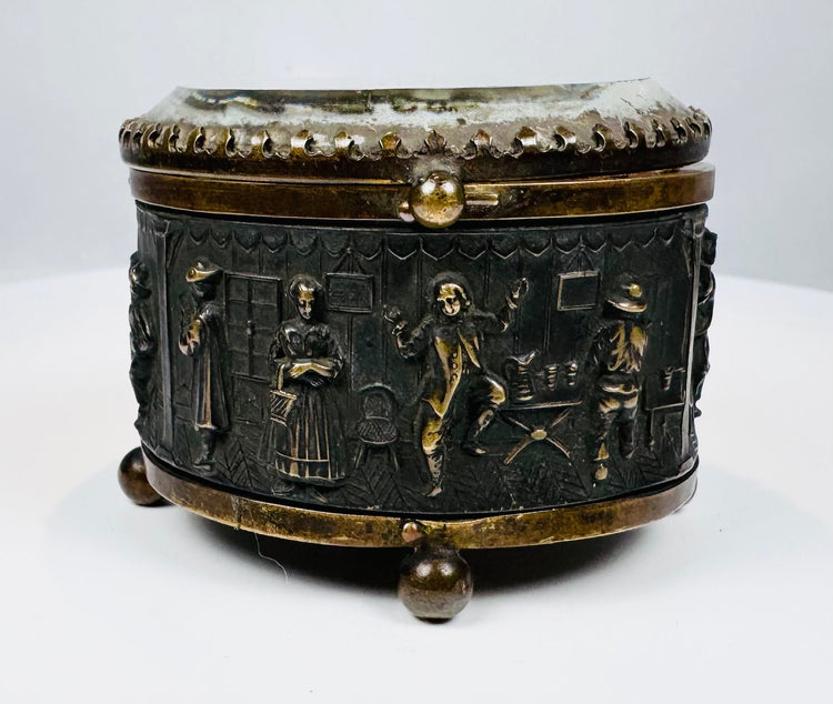 Victorian-era French metal casket with bas-relief tavern scene
