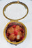 Beveled glass lid and decorative border on a French jewelry box