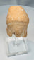 Greek archaeological terracotta fragment on a clear display stand