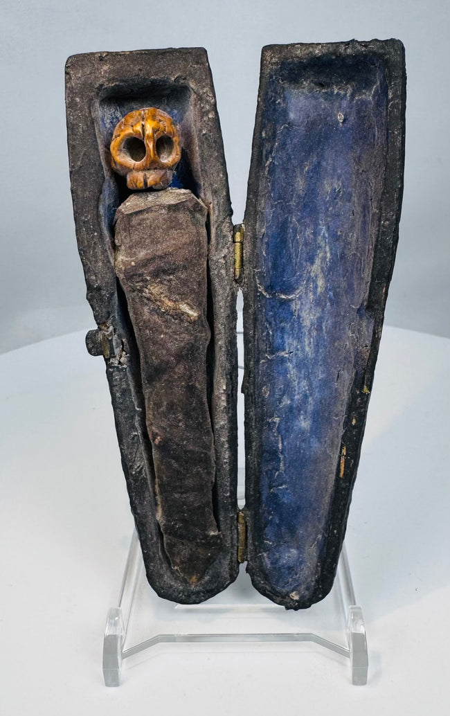 Carved skull figure inside an Alpine contemplation coffin
