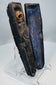 Black-painted wooden coffin with Christian mortality symbols