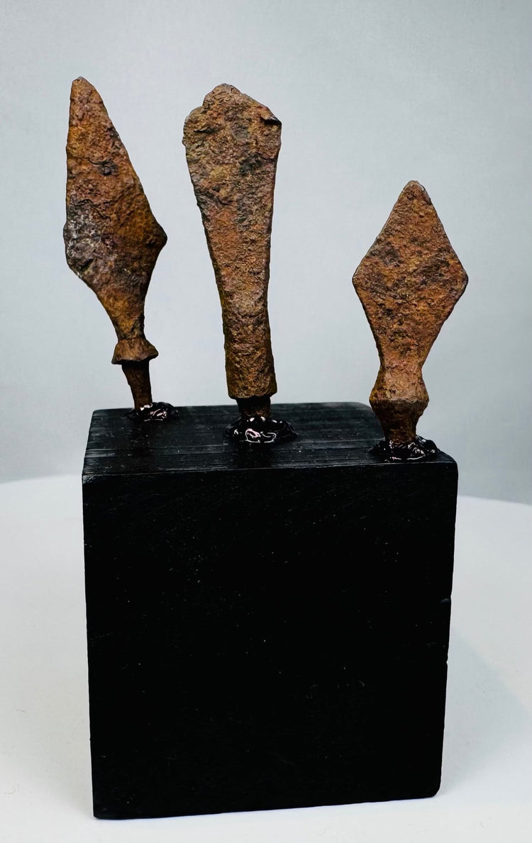 Roman iron arrowheads and javelin points mounted for display