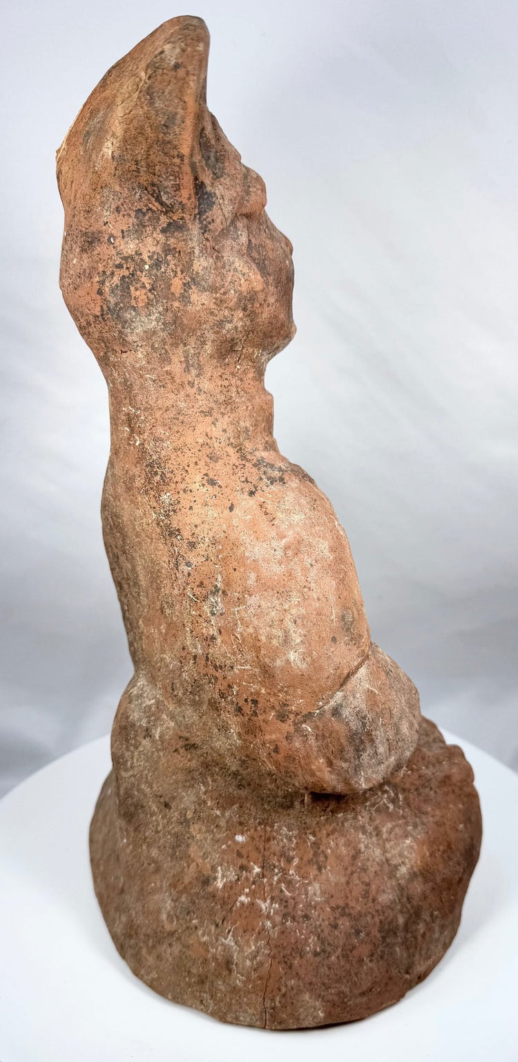 Seated Han Dynasty tomb attendant in layered terracotta robes