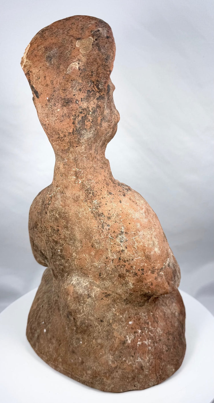 Side view of Han Dynasty terracotta attendant with tall cap