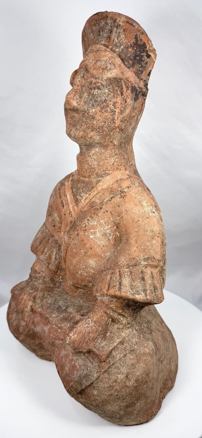 Han Dynasty terracotta figure with hands positioned across lap