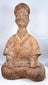 Han Dynasty terracotta musician with tall headdress and crossed legs