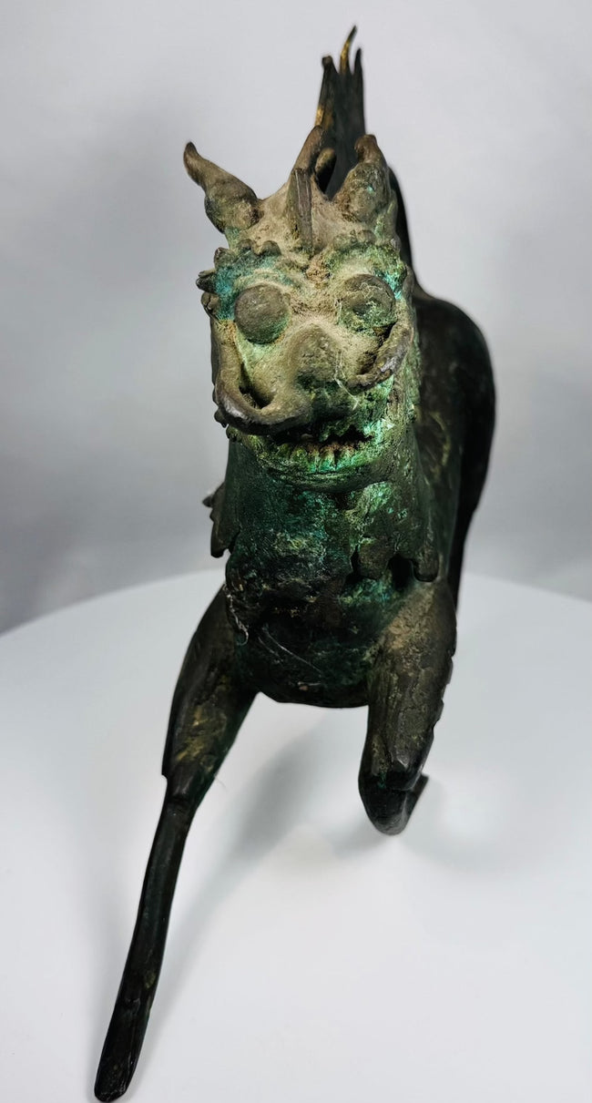 Antique Chinese qilin sculpture with naturally aged green patina