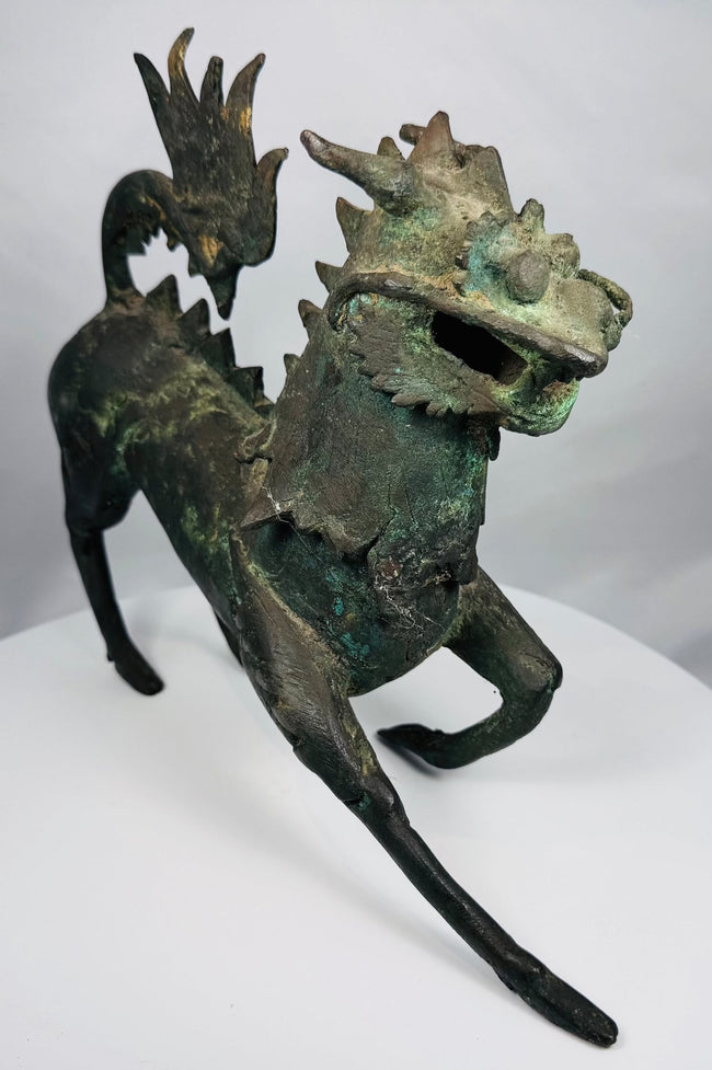 Detail of the flame-shaped tail on a Chinese bronze qilin