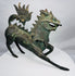 Side profile of a Chinese bronze qilin with an arched tail