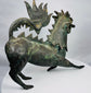 Chinese mythical beast sculpture with an open mouth and visible teeth