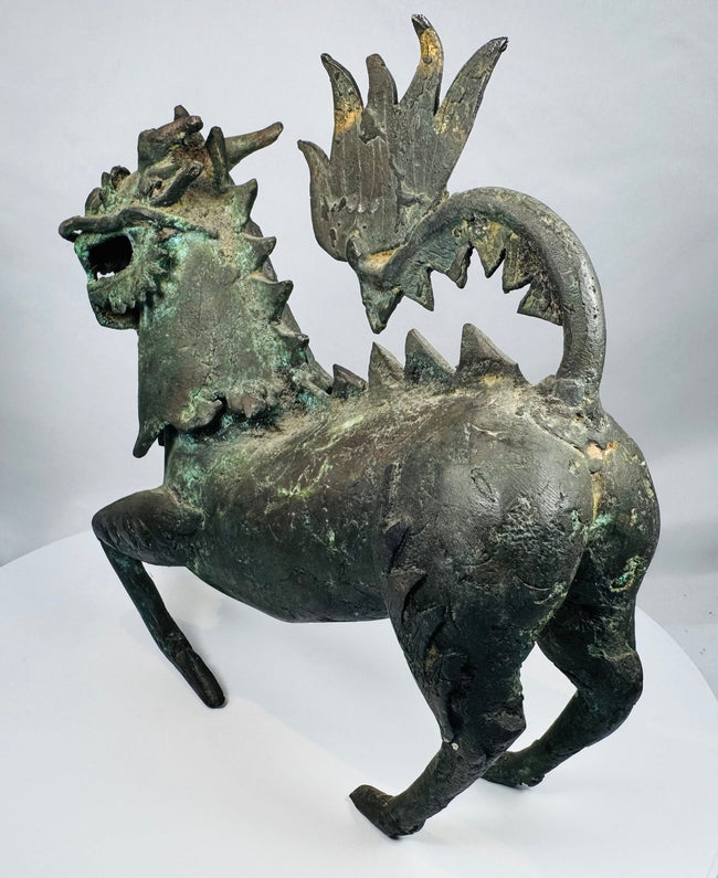 Hollow-cast Chinese bronze qilin with turquoise oxidation