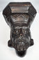 Side view of a 19th-century carved wooden architectural bracket