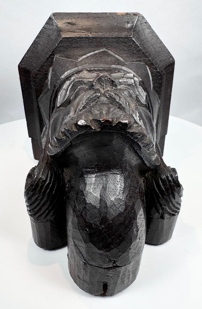Gothic Revival wood carving with geometric chevron decoration