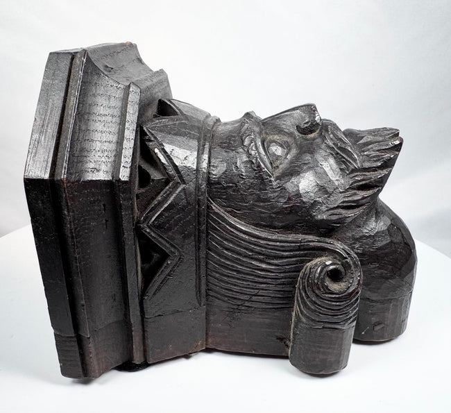 Antique wooden corbel with crown-like architectural headpiece