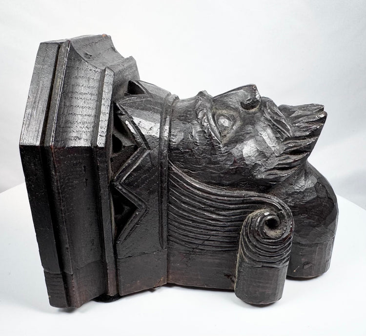Antique wooden corbel with crown-like architectural headpiece