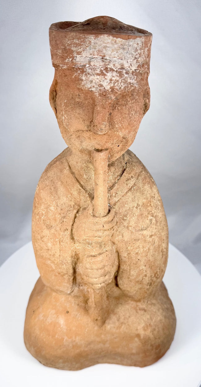 Han Dynasty seated musician wearing a broad-sleeved robe