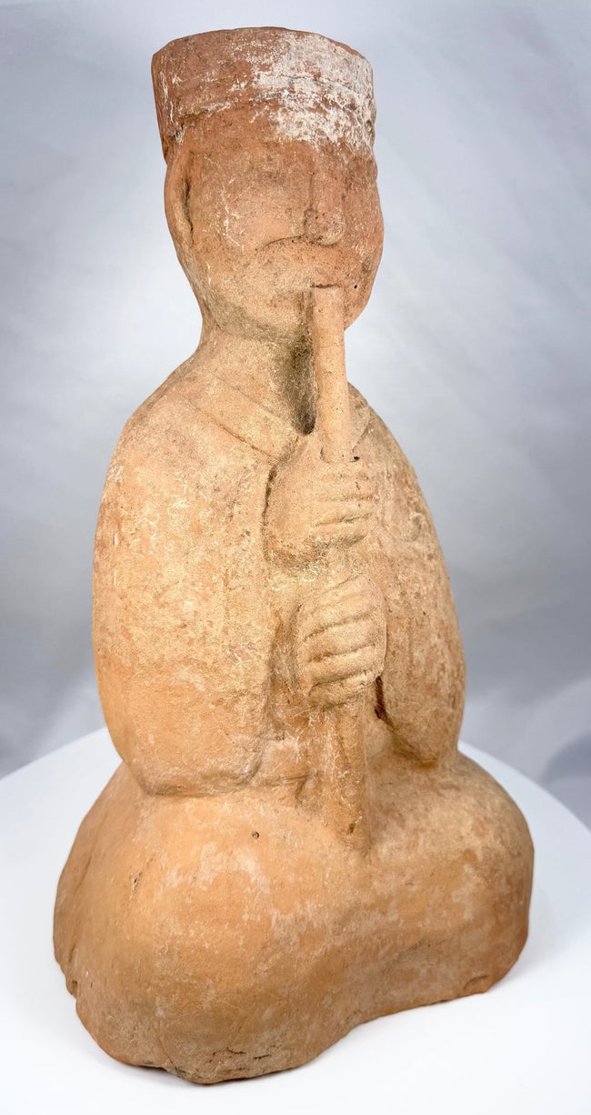 Detail of the tall headdress on a Han Dynasty musician figure