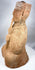 Profile of an ancient Chinese musician holding a vertical pipe