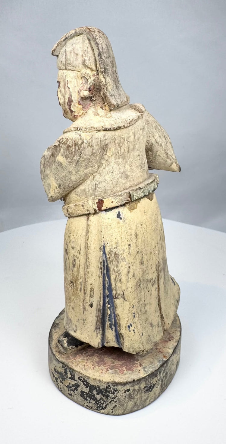 Detail of the painted face on a Qing Dynasty wooden attendant