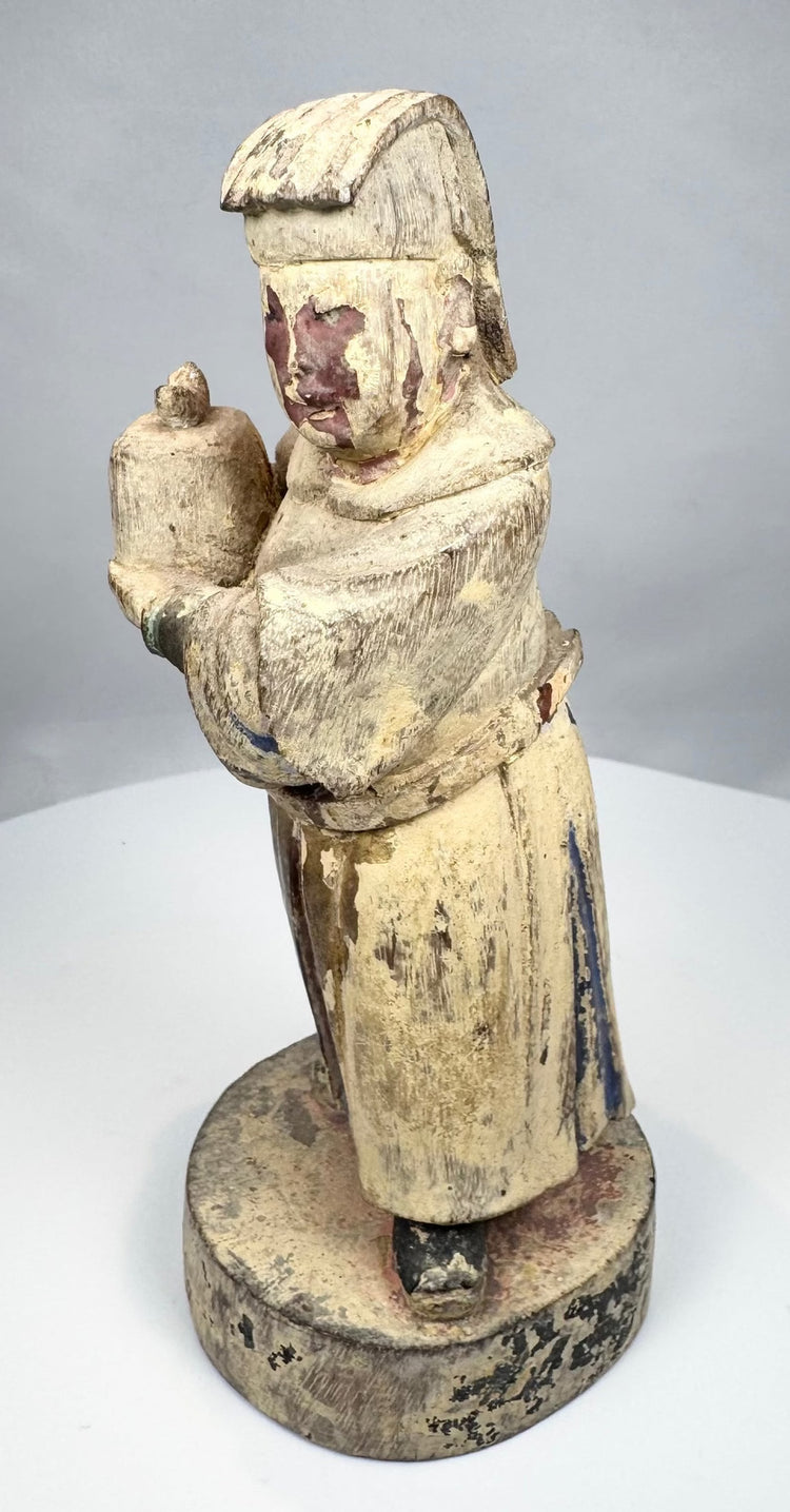 Antique Chinese offering bearer standing on a circular pedestal
