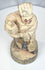Underside of a hand-carved Chinese wooden attendant figure